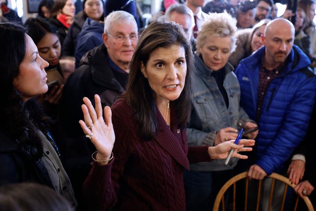 Republican presidential candidate and former UN Ambassador Nikki Haley talks with people at the historic Robie Country Store on January 18, 2024 in Hooksett, New Hampshire
