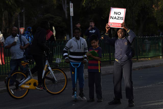 <p>File. A young boy carries a placard titled ‘No Nazis’ during a demonstration in Melbourne on 4 December 2017</p>