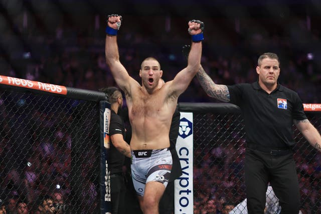 <p>Sean Strickland celebrates winning the UFC middleweight title from Israel Adesanya</p>