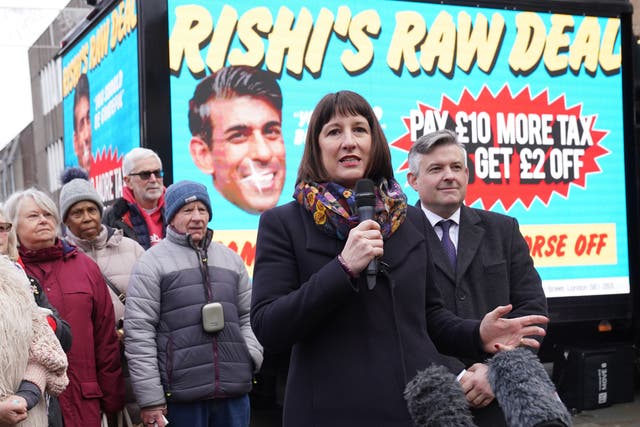 <p>Shadow chancellor Rachel Reeves and shadow paymaster general Jonathan Ashworth (right) in Wellingborough, North Northamptonshire, on Friday to unveil Labour’s poster campaign of what it calls ‘Rishi’s raw deal’ for taxpayers ahead of the reduction in national insurance contributions on 6 January</p>