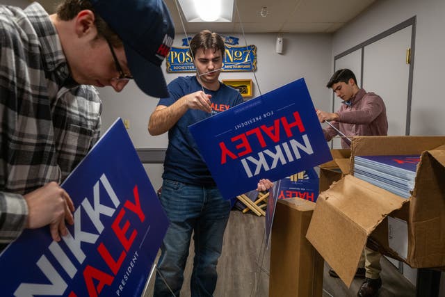 <p>Supporters make yard signs before a campaign event with Republican presidential candidate Nikki Haley</p>